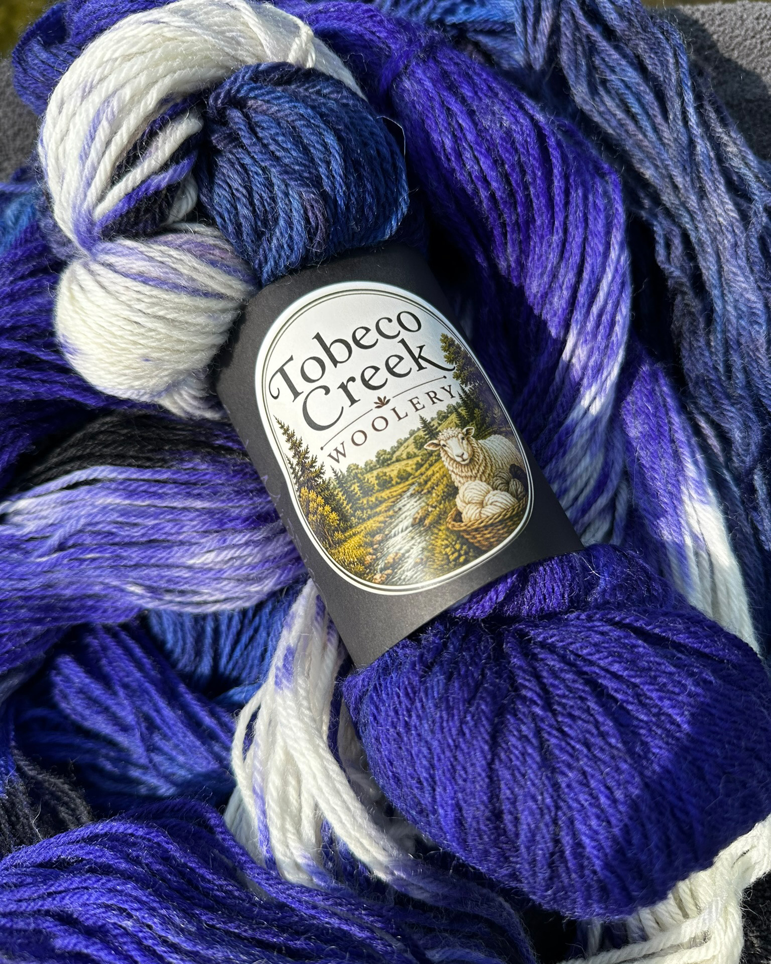 Old Mission Grapes yarn skeins grouped together